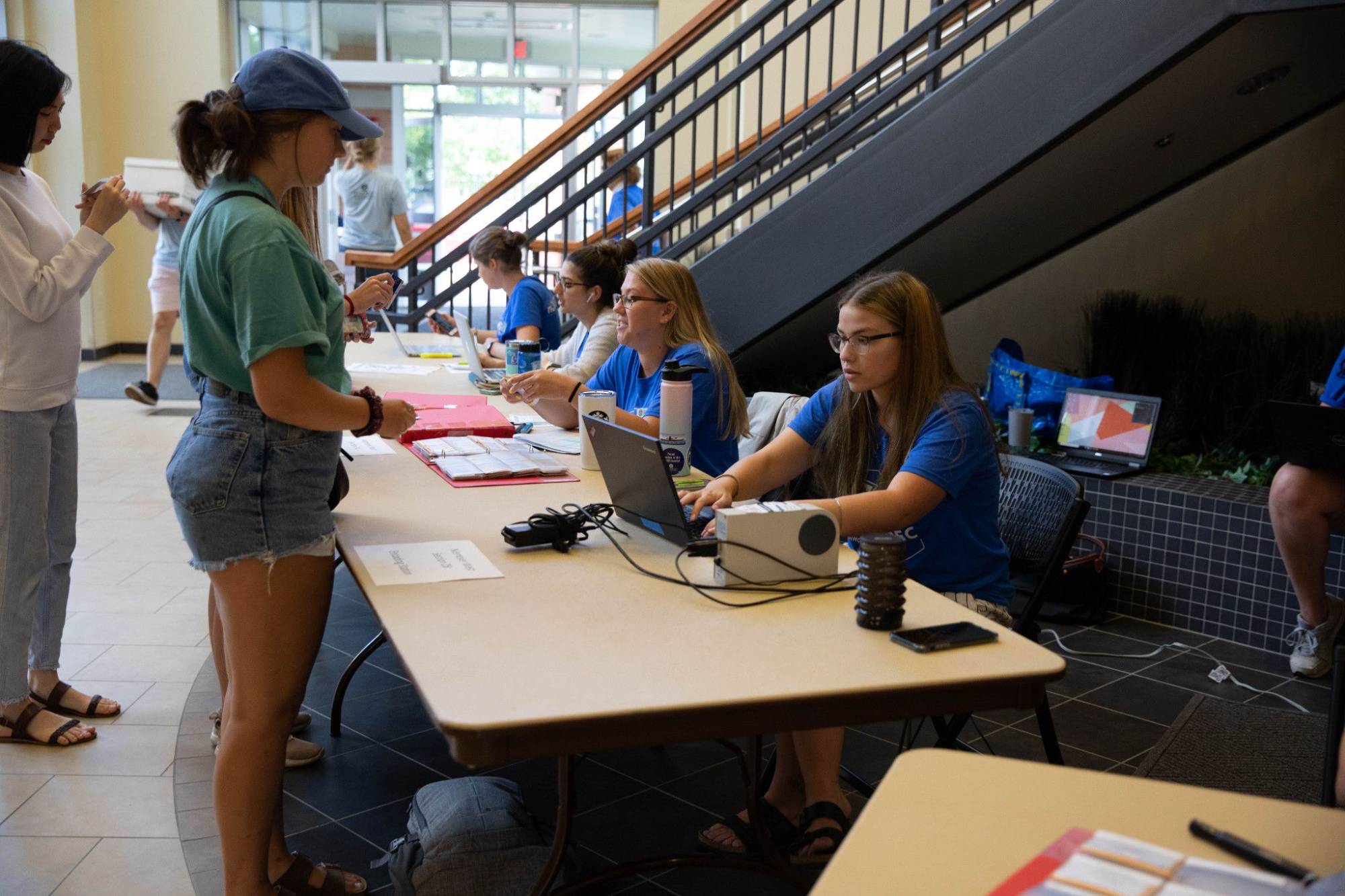 student at support desk on move-in day